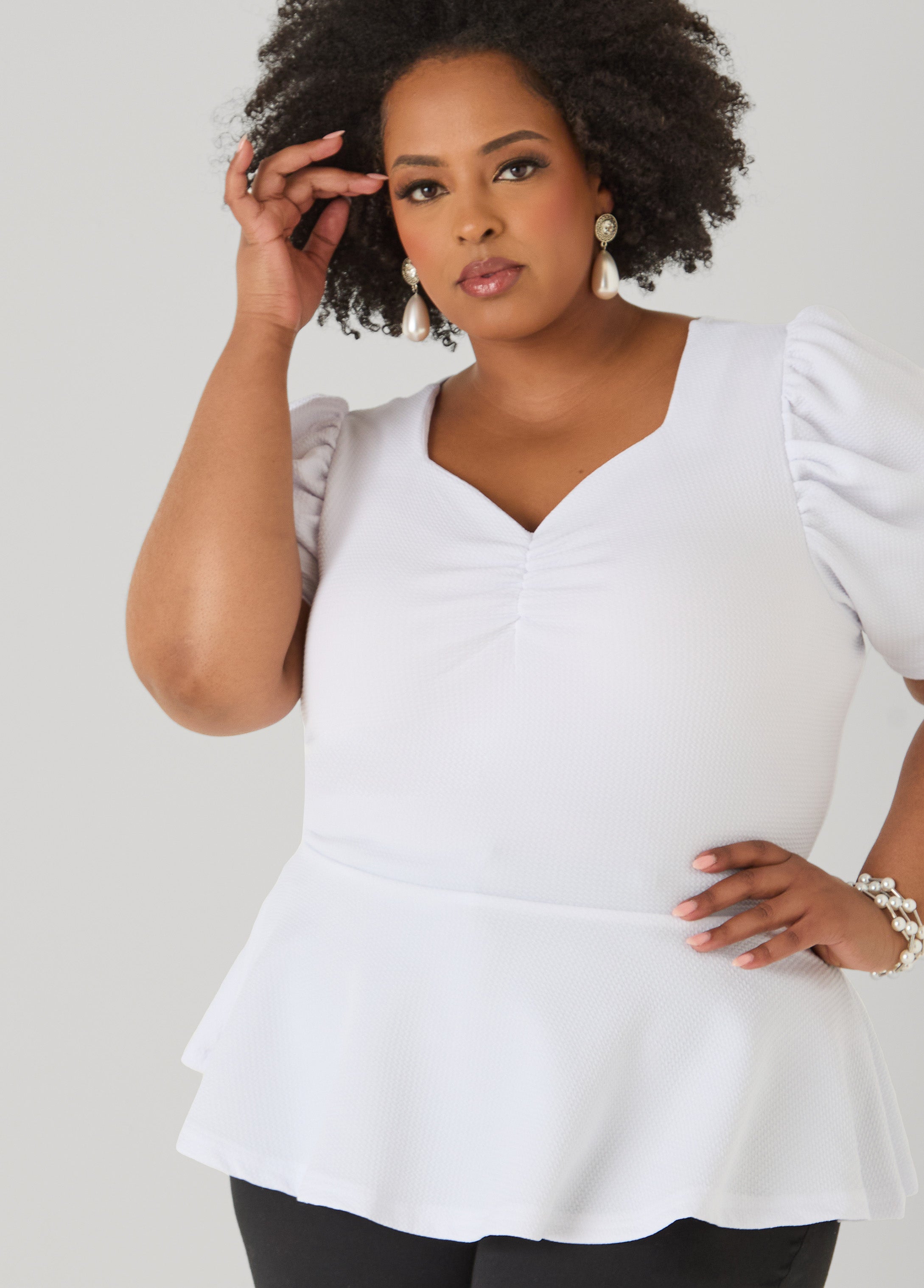 Puff Sleeved Textured Peplum Top