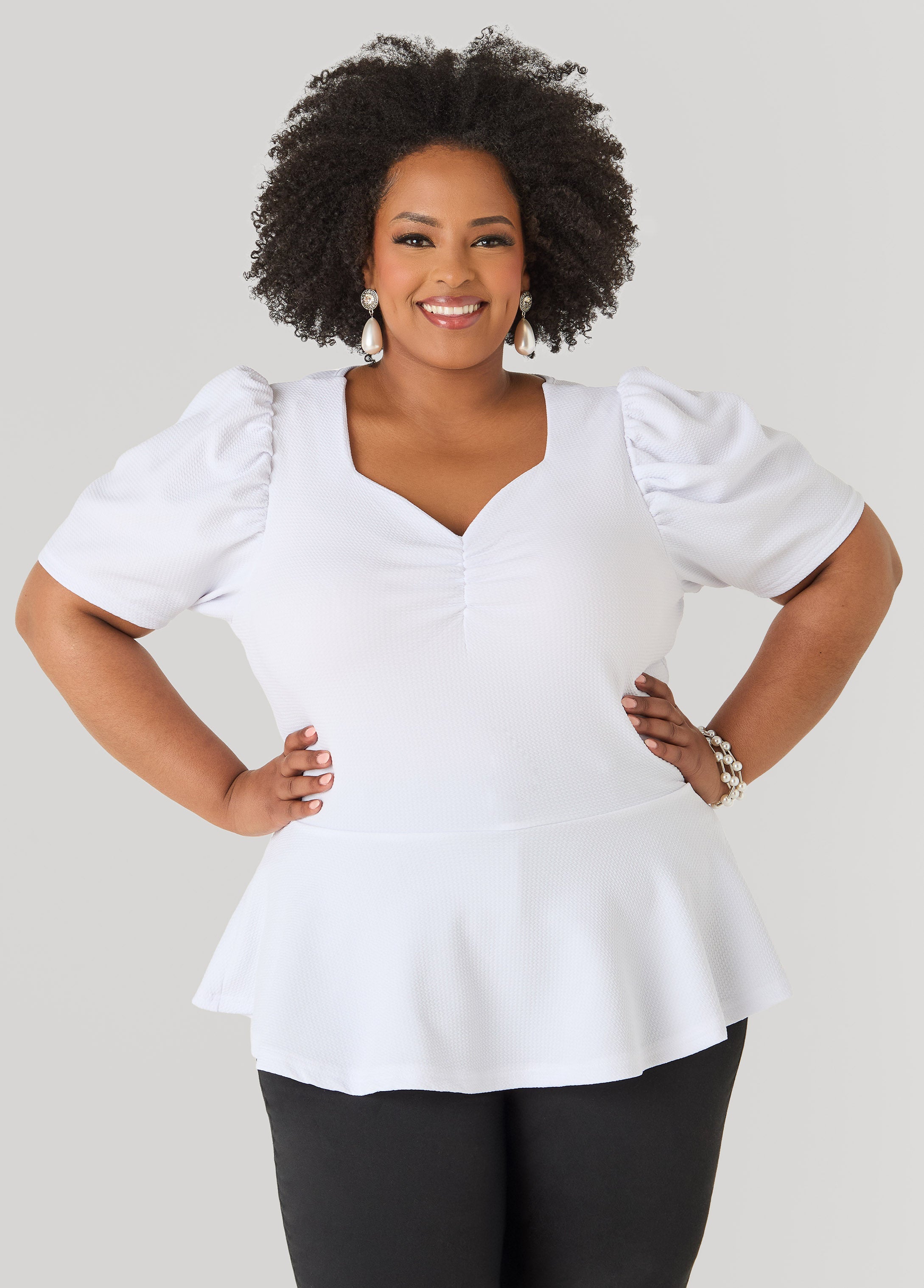 Puff Sleeved Textured Peplum Top
